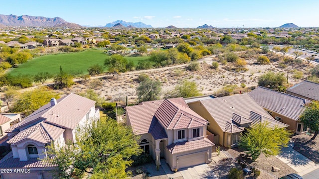 birds eye view of property with a mountain view