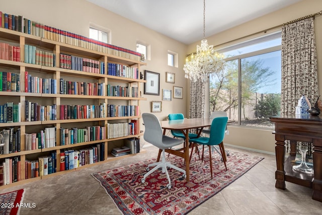 living area with an inviting chandelier, a healthy amount of sunlight, and light tile patterned flooring