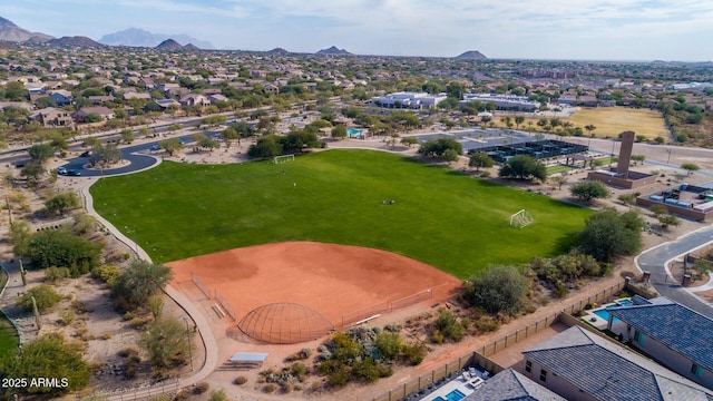 birds eye view of property featuring a mountain view