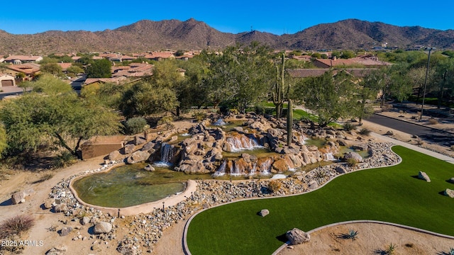 birds eye view of property featuring a mountain view