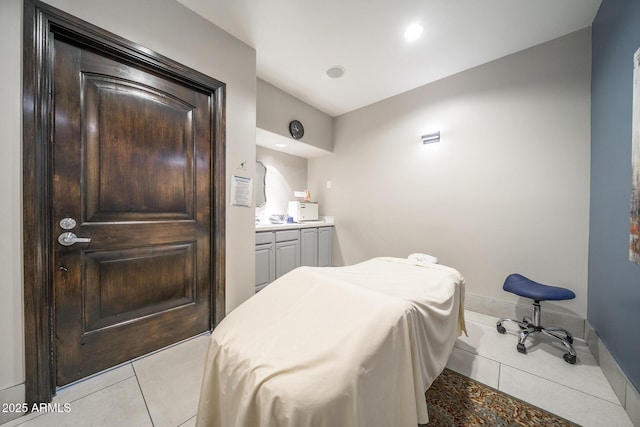 bedroom with light tile patterned flooring