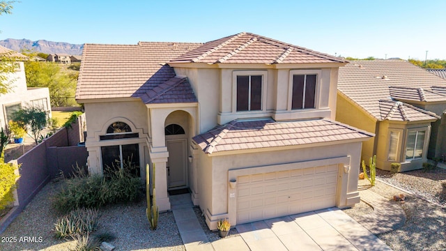 view of front of home featuring a garage and a mountain view