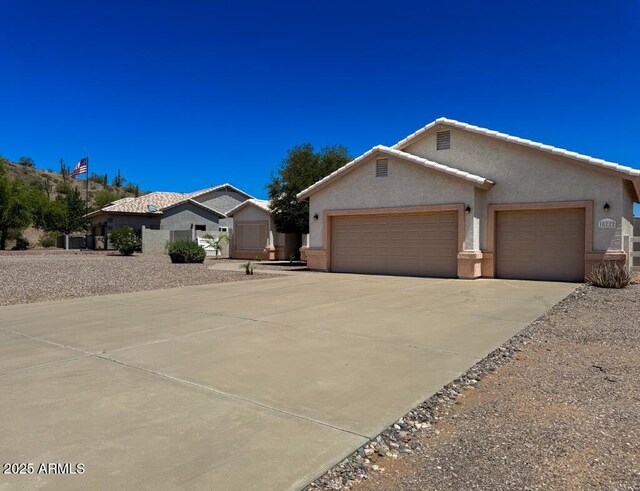 10722 W Quartz Dr, Casa Grande, AZ 85193 - single story home featuring driveway, an attached garage, and stucco siding