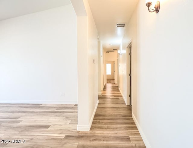 10722 W Quartz Dr, Casa Grande, AZ 85193 - corridor featuring light wood-style flooring and baseboards