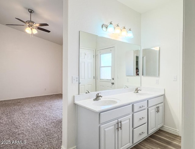 10722 W Quartz Dr, Casa Grande, AZ 85193 - bathroom featuring a ceiling fan, double vanity, and lofted ceiling