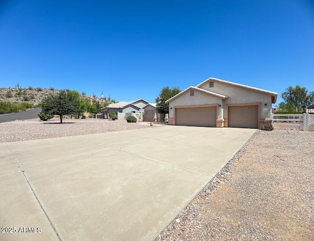 10722 W Quartz Dr, Casa Grande, AZ 85193 - view of front of property featuring concrete driveway, stucco siding, and an attached garage