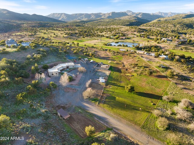 bird's eye view featuring a water and mountain view