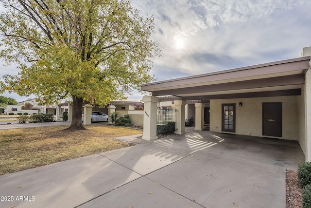 view of patio / terrace with a carport