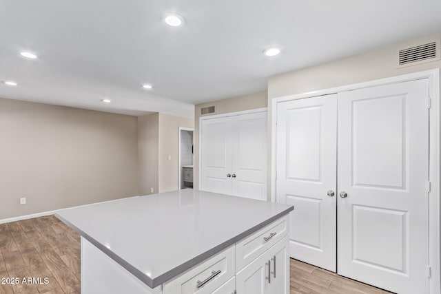 kitchen featuring white cabinetry and a center island