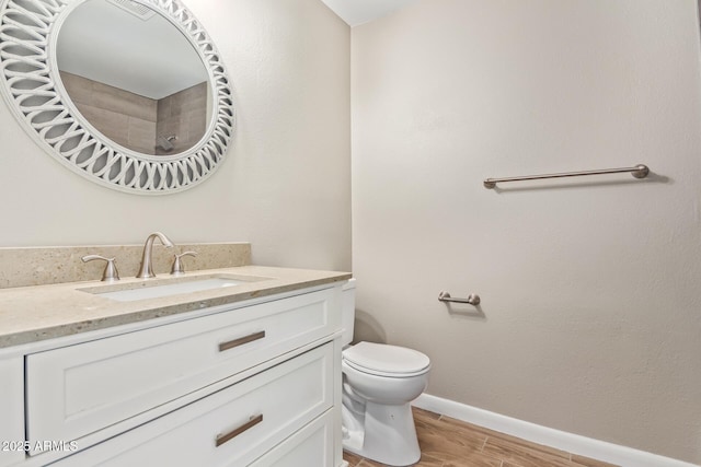 bathroom featuring toilet and vanity