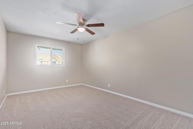 unfurnished room with ceiling fan and carpet flooring