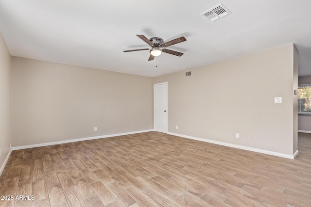 empty room featuring light hardwood / wood-style floors and ceiling fan