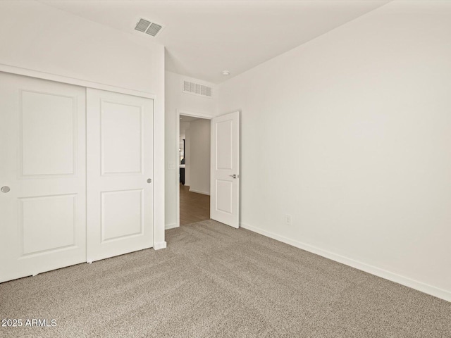 unfurnished bedroom featuring a closet and carpet