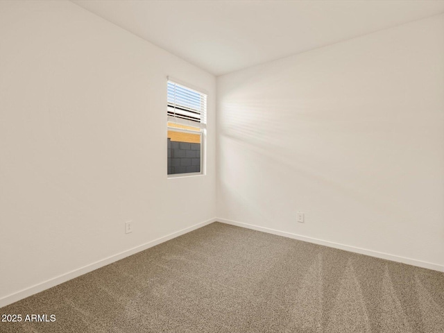 unfurnished room featuring carpet