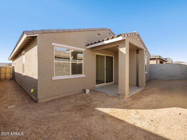 back of house featuring a patio area