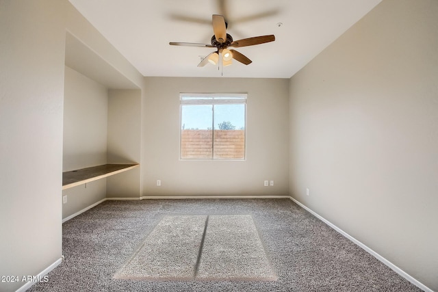 carpeted empty room with ceiling fan