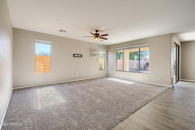 unfurnished room featuring ceiling fan and light hardwood / wood-style floors