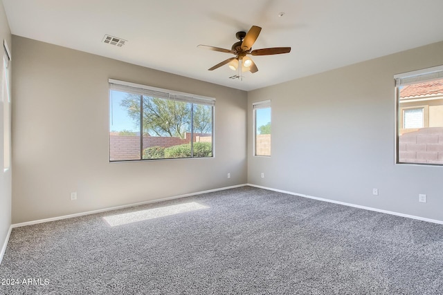 spare room with ceiling fan and carpet floors