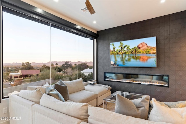 cinema room featuring ceiling fan