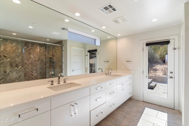 bathroom with vanity and walk in shower