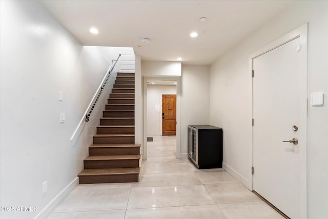 stairs with tile patterned flooring