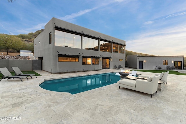 view of pool featuring a patio area and an outdoor fire pit