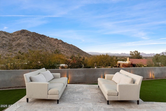 view of patio / terrace featuring a mountain view