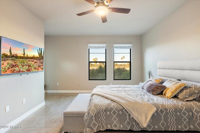 tiled bedroom with ceiling fan