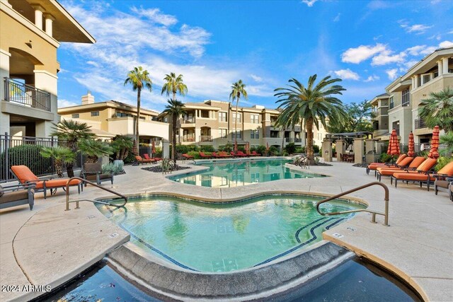 view of swimming pool featuring a patio area