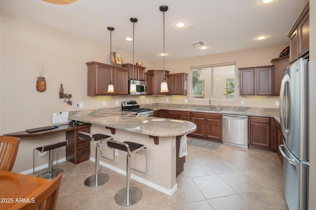 kitchen with light stone counters, a peninsula, light tile patterned floors, visible vents, and stainless steel appliances