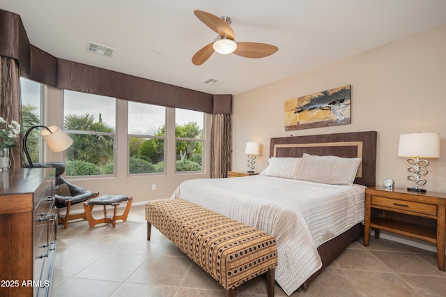 bedroom with light tile patterned floors, baseboards, and visible vents