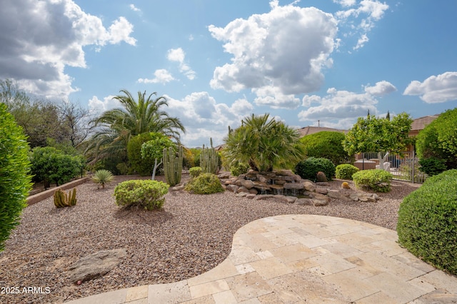 view of yard featuring fence and a patio