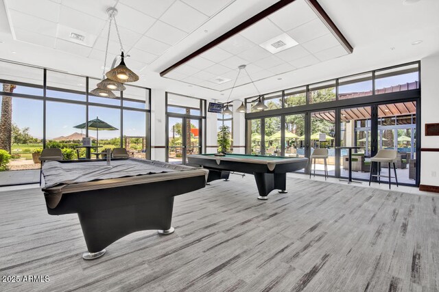 rec room with pool table, expansive windows, and visible vents