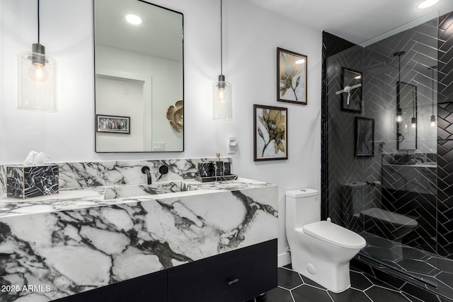 full bath with tile patterned flooring, toilet, a tile shower, recessed lighting, and vanity