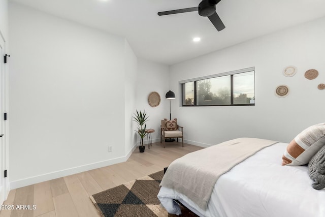 bedroom featuring light wood-style flooring, recessed lighting, baseboards, and ceiling fan