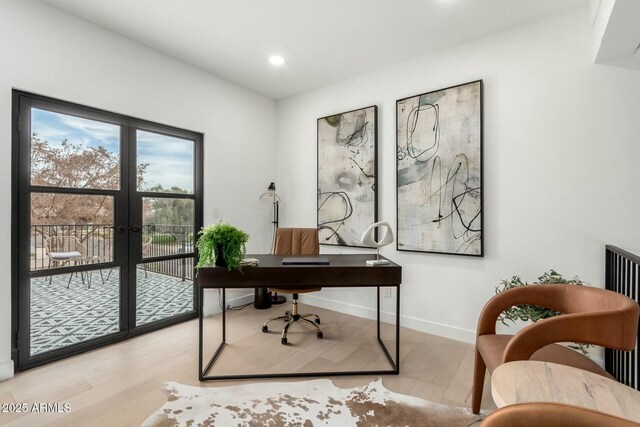 home office with light wood finished floors, radiator, baseboards, recessed lighting, and french doors