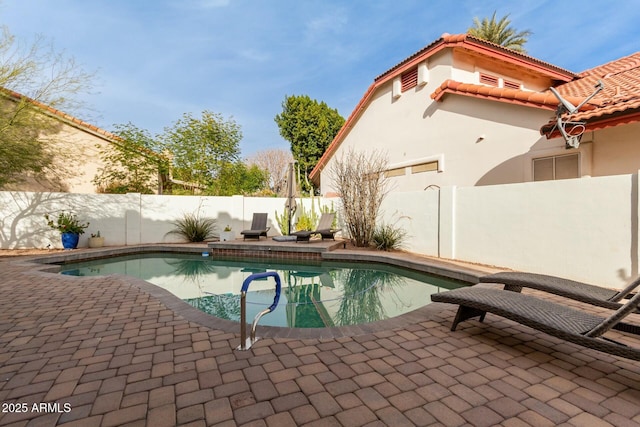 view of pool featuring a patio area, a fenced in pool, and a fenced backyard