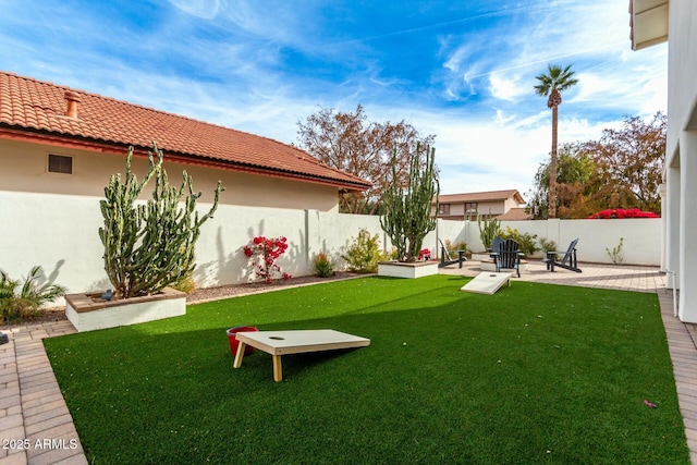 view of yard with a patio and a fenced backyard