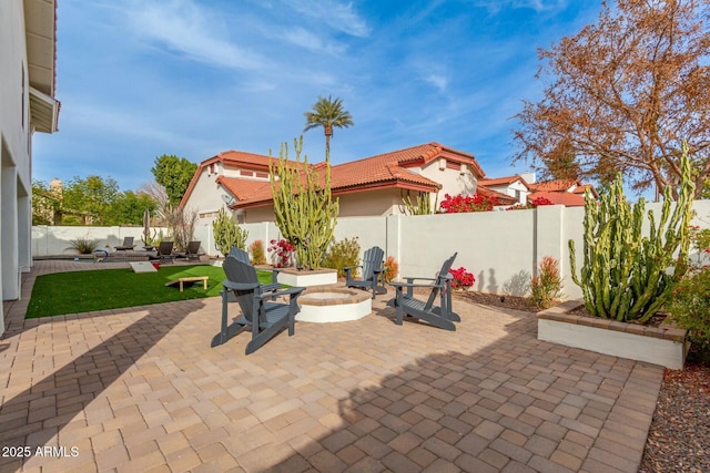 view of patio / terrace featuring a fenced backyard and an outdoor fire pit