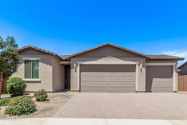 1268 E Jahns Dr, Casa Grande, AZ 85122 - ranch-style house featuring a garage, stucco siding, and a tile roof