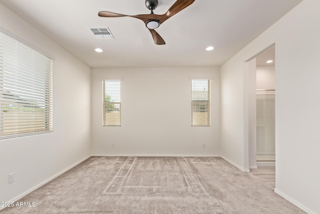 1268 E Jahns Dr, Casa Grande, AZ 85122 - spare room featuring a ceiling fan, light colored carpet, and a wealth of natural light
