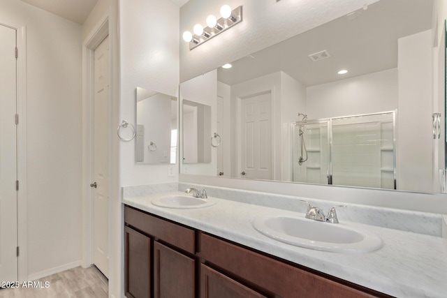 1268 E Jahns Dr, Casa Grande, AZ 85122 - bathroom with double vanity, visible vents, a sink, and a stall shower