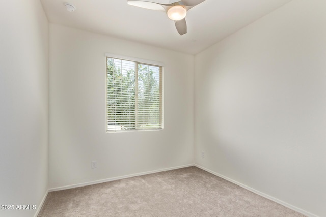 1268 E Jahns Dr, Casa Grande, AZ 85122 - spare room featuring light colored carpet, baseboards, and ceiling fan