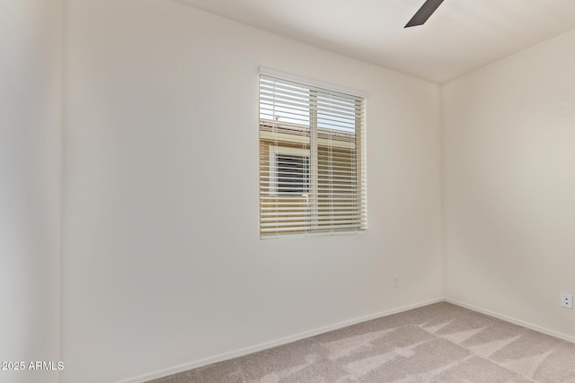 1268 E Jahns Dr, Casa Grande, AZ 85122 - empty room with baseboards, ceiling fan, and light carpet