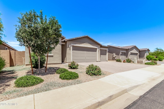 1268 E Jahns Dr, Casa Grande, AZ 85122 - ranch-style home featuring a tiled roof, an attached garage, and stucco siding