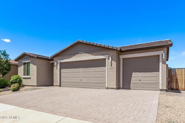 1268 E Jahns Dr, Casa Grande, AZ 85122 - single story home featuring decorative driveway, a garage, stucco siding, and a tiled roof