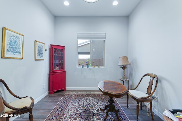 living area featuring wood finish floors, baseboards, and recessed lighting