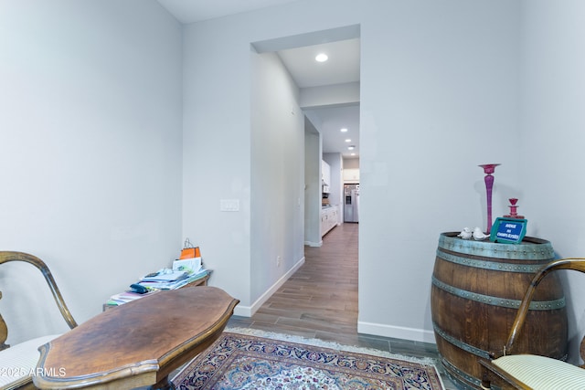 interior space with recessed lighting, baseboards, and wood finished floors