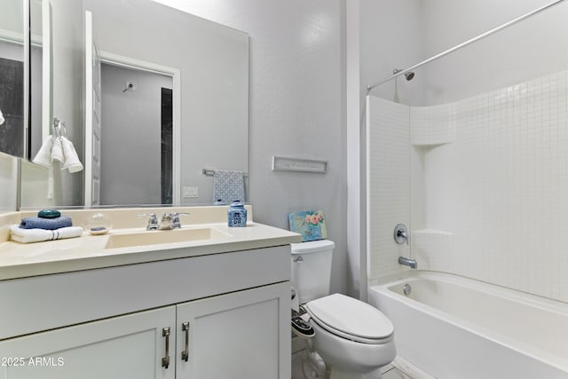 full bathroom featuring bathing tub / shower combination, vanity, and toilet