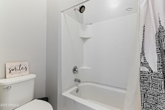 bathroom featuring toilet and shower / bath combo with shower curtain